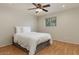 Inviting bedroom with hardwood floors, neutral walls, and ceiling fan, creating a cozy retreat at 6408 E Gary Rd, Scottsdale, AZ 85254