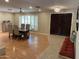 Open dining area with seating for six, lovely light fixture, and decorative shutters at 6408 E Gary Rd, Scottsdale, AZ 85254