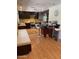 Kitchen with dark cabinets, stainless steel appliances, wine cooler and seating area at 6408 E Gary Rd, Scottsdale, AZ 85254