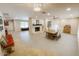 Spacious living room with large fireplace, tile flooring, and a dining area that's great for entertaining at 6408 E Gary Rd, Scottsdale, AZ 85254