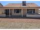 View of back of home showing covered patio and xeriscaping at 6873 S Lake Forest Ct, Chandler, AZ 85249