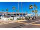 Apartment building exterior surrounded by parking spots and palm trees at 6873 S Lake Forest Ct, Chandler, AZ 85249