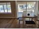Bright dining area with sliding glass doors and wood-look floors, perfect for casual meals at 6873 S Lake Forest Ct, Chandler, AZ 85249