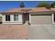 Charming single-story home with a well-maintained yard, desert landscaping and a spacious two-car garage at 6873 S Lake Forest Ct, Chandler, AZ 85249