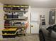 Garage with shelving and stackable laundry unit at 6873 S Lake Forest Ct, Chandler, AZ 85249