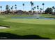Beautiful golf course with a pond and fountain, showcasing lush green fairways and meticulously maintained grounds at 6873 S Lake Forest Ct, Chandler, AZ 85249