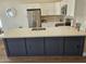 Bright kitchen with stainless steel appliances, quartz countertop island and white shaker cabinets at 6873 S Lake Forest Ct, Chandler, AZ 85249