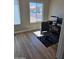Well-lit home office featuring a neutral color palette and wood floors at 6873 S Lake Forest Ct, Chandler, AZ 85249