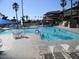 Inviting community swimming pool with lounge chairs, tables, and a gazebo, perfect for relaxing and enjoying the outdoors at 6873 S Lake Forest Ct, Chandler, AZ 85249