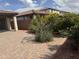 Beautiful backyard with paver patio, desert plants, block wall and awning at 7046 N 84Th Dr, Glendale, AZ 85305