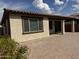 View of the backyard with patio, desert landscaping, and an awning at 7046 N 84Th Dr, Glendale, AZ 85305