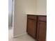 Bathroom with tile floors, vanity with storage, and tile backsplash at 7046 N 84Th Dr, Glendale, AZ 85305