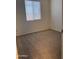 Neutral bedroom features carpeted floor, a window with blinds offering natural light, and fresh paint at 7046 N 84Th Dr, Glendale, AZ 85305
