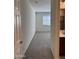 Bright bedroom showcasing neutral colored walls, carpet, and a window for natural light at 7046 N 84Th Dr, Glendale, AZ 85305