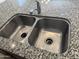 A stainless steel kitchen sink sits in a large kitchen island at 7046 N 84Th Dr, Glendale, AZ 85305