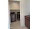 Laundry room includes modern stainless steel washer and dryer sets for household chores at 7046 N 84Th Dr, Glendale, AZ 85305