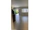 Bright and spacious living room with large tiled flooring and sliding glass doors at 7046 N 84Th Dr, Glendale, AZ 85305