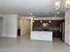 The house has an open floor plan with the kitchen, dining area, and living room combined at 7046 N 84Th Dr, Glendale, AZ 85305