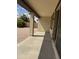 Covered patio with exposed beams, brick pavers, and a view of the landscaped backyard at 7046 N 84Th Dr, Glendale, AZ 85305