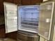 The open stainless steel refrigerator features a Slim SpacePlus Ice System and fresh air filter at 7046 N 84Th Dr, Glendale, AZ 85305