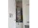 Efficient water heater installed in a utility closet, ensuring hot water on demand at 7046 N 84Th Dr, Glendale, AZ 85305