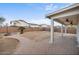 Spacious backyard with a brick-paved patio, perfect for entertaining, and surrounded by a block fence at 7309 W Getty Dr, Phoenix, AZ 85043