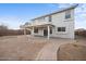 View of the home's back exterior, featuring a covered patio and a well-maintained backyard at 7309 W Getty Dr, Phoenix, AZ 85043