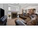 Inviting living room with a stone fireplace and plush seating at 7309 W Getty Dr, Phoenix, AZ 85043