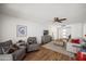 Open concept living room with neutral decor, wood floors, and plenty of natural light at 7630 E Pasadena Ave, Scottsdale, AZ 85250