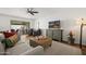 Inviting living room with neutral decor, ceiling fan, and sliding glass door at 7630 E Pasadena Ave, Scottsdale, AZ 85250