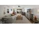Cozy living room featuring neutral decor, an open layout, and access to the outdoors at 7630 E Pasadena Ave, Scottsdale, AZ 85250