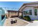 Inviting backyard patio with outdoor kitchen, pergola, and cozy seating area at 7824 S 33Rd Ln, Laveen, AZ 85339
