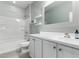 Bathroom features a shower over tub combo and a white vanity with a framed mirror at 7824 S 33Rd Ln, Laveen, AZ 85339