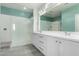 Elegant bathroom with double sinks, a glass-enclosed shower, and modern fixtures, offering a luxurious feel at 7824 S 33Rd Ln, Laveen, AZ 85339