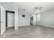 Calm bedroom with tiled floors, neutral walls, a ceiling fan, and ample natural light from multiple windows at 7824 S 33Rd Ln, Laveen, AZ 85339