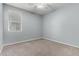Bedroom featuring a ceiling fan and a large window that provides lots of natural light at 7824 S 33Rd Ln, Laveen, AZ 85339