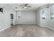 Serene bedroom with neutral walls, large windows, a ceiling fan, and tile flooring for a modern look at 7824 S 33Rd Ln, Laveen, AZ 85339