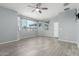 Bright bedroom with large windows, ceiling fan, and neutral walls, offering a peaceful retreat at 7824 S 33Rd Ln, Laveen, AZ 85339