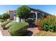 Beautifully landscaped front yard with lush greenery and a well-maintained home exterior at 7824 S 33Rd Ln, Laveen, AZ 85339