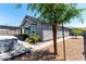 Charming exterior view of the home with landscaped backyard and outdoor entertainment space at 7824 S 33Rd Ln, Laveen, AZ 85339