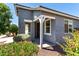 Inviting front exterior with a covered porch, neutral paint, and charming landscaping at 7824 S 33Rd Ln, Laveen, AZ 85339