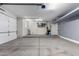 Spacious two car garage with epoxy flooring and ample overhead lighting at 7824 S 33Rd Ln, Laveen, AZ 85339