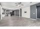 Open-concept living room with tile floors, a view to the kitchen, and plenty of natural light at 7824 S 33Rd Ln, Laveen, AZ 85339
