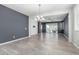 Open living area with chandelier, access to patio, and neutral wall color for personalization at 7824 S 33Rd Ln, Laveen, AZ 85339