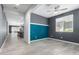 Modern living room with tile flooring, decorative accent wall and open concept design at 7824 S 33Rd Ln, Laveen, AZ 85339