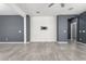 Minimalist living room with neutral colors and modern accents including a wall mount for a TV at 7824 S 33Rd Ln, Laveen, AZ 85339