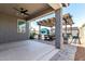 An outdoor patio area features an outdoor kitchen, pergola, seating, and pavers at 7824 S 33Rd Ln, Laveen, AZ 85339