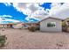 This home features a large back yard with desert landscaping and mature trees, creating a private retreat at 8248 E Emelita Ave, Mesa, AZ 85208