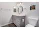 Bathroom featuring a modern vanity, decorative mirrors, and white walls at 8248 E Emelita Ave, Mesa, AZ 85208
