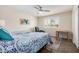 Bedroom featuring twin beds, ceiling fan and natural light at 8248 E Emelita Ave, Mesa, AZ 85208